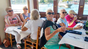 Group activities organized by the East Area Family YMCA include a boat trip on Skaneateles Lake.