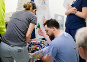 Nurse practitioners Meg McDonnell and Evan Belanger distributing toys.