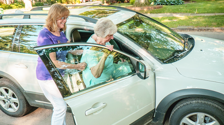 A senior getting a ride with a volunteer. Photo courtesy of Gelfand-Piper Photography.