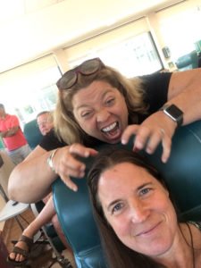 Jennifer Jensen, top left, shares a lighthearted moment with sister Wendy Jensen at Hematology-Oncology Associates’ infusion center. 