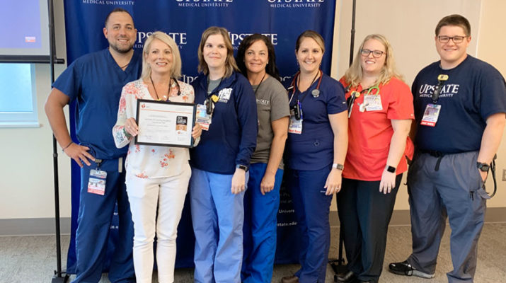 This is the first year the resuscitation team of Upstate University Hospital was honored by the American Heart Association/American Stroke Association. Members, from left are, Matt Grover, resuscitation program coordinator; Ellen Anderson, adult SWAT team/ICU float and support pool nurse manager, resuscitation program manager; Nicole Staring, adult SWAT nurse; Christina Martino, adult SWAT nurse/clinical trainer ICU float & support pool; Colleen Diekemper, adult SWAT nurse; Janice Maggio adult SWAT nurse; and Charles Berardi adult SWAT nurse.  