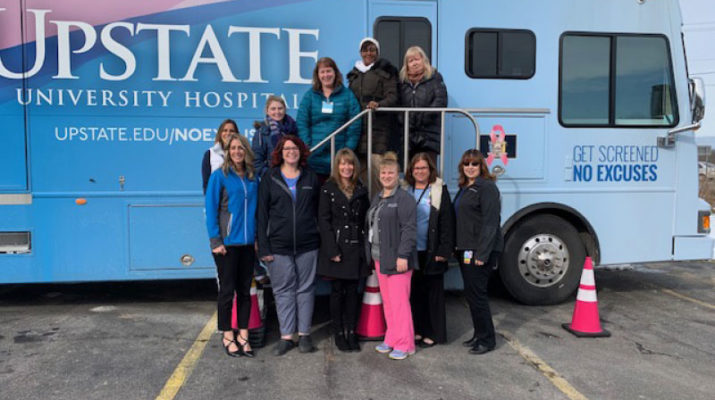 Mammography makes a stop in Parish. From far right at the top of the stairs are Kerrie Randall, Tiffany Caesar, Kerry Hazen, Jennifer MacBlane and Michelle Pavlovitz. Bottom row, from left: Tricia Peter Clark, Chelsea Forney, Heather Gigon, Jennifer McGrew, Nancy Deavers and Sheri Guilds.