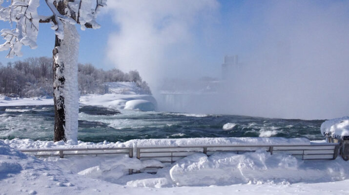 Niagara Falls never freezes entirely, however the combination of the cold and wind make this your winter wonderland workout. Shown is a mist rising above the falls at Niagara Falls State Park.