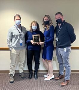 From left, physician Patrick Carguello, senior vice president and chief medical officer at ConnextCare; Celeste Carnes, NP; Tricia Peter-Clark, president and chief executive officer at ConnextCare; Michael Backus, chairman of the board.